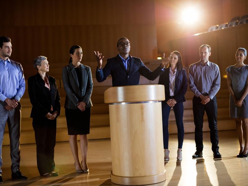 Male business executive giving a speech - Speak at seminars to establish yourself and your brand as experts in your field - Image