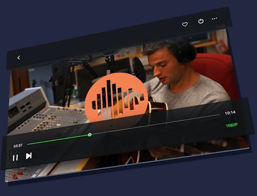 man in the studio playing the guitar